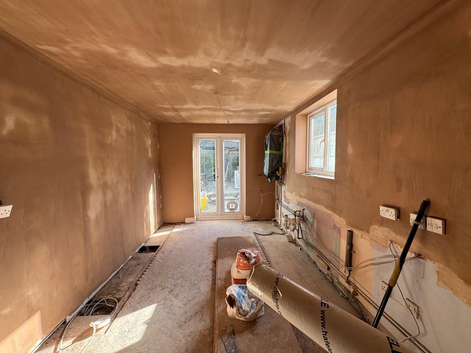 Freshly plastered rear extension with French doors onto the garden