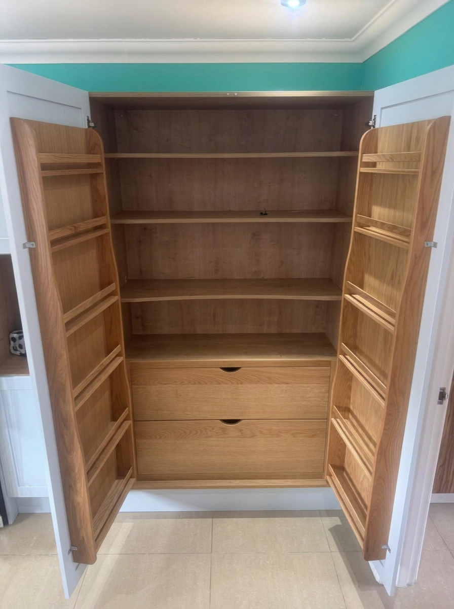 Bespoke oak pantry cupboard with shelving, drawers and spice-rack doors, carpentry in Littlehampton